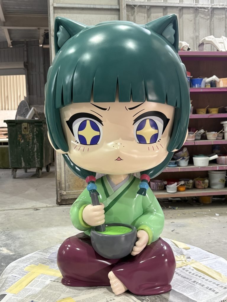 A custom anime-style fiberglass statue of a chibi character with cat ears, holding a bowl of matcha, created for pop culture retail display.
