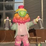 Custom life-size fiberglass statue of a graffiti artist character, created for a U.S. street culture exhibition.