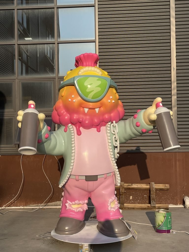 Custom life-size fiberglass statue of a graffiti artist character, created for a U.S. street culture exhibition.